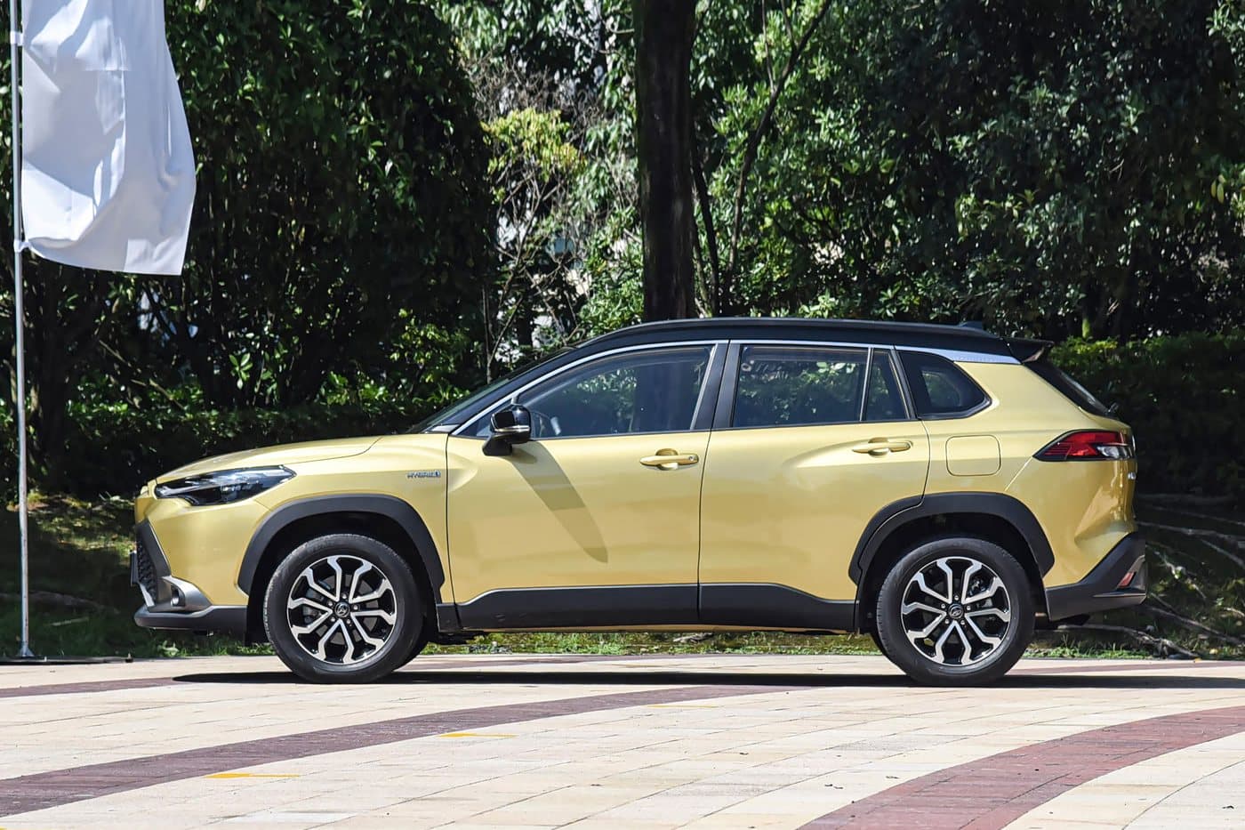 2023 Toyota Frontlander — side profile, Black roof / Amber Gold, compact SUV for export